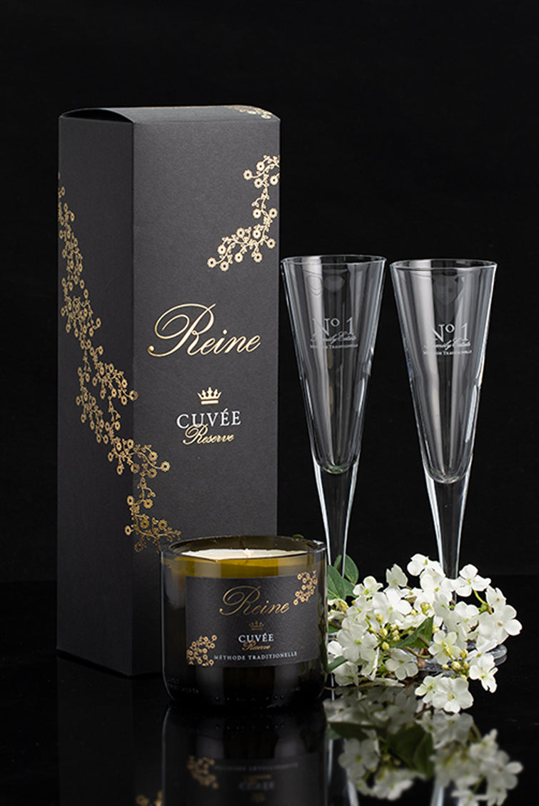 No.1 Family Estate gift pack with a bottle of Reine Cuvee methode traditionelle in a gift box, two flutes, a candle and faux flowers